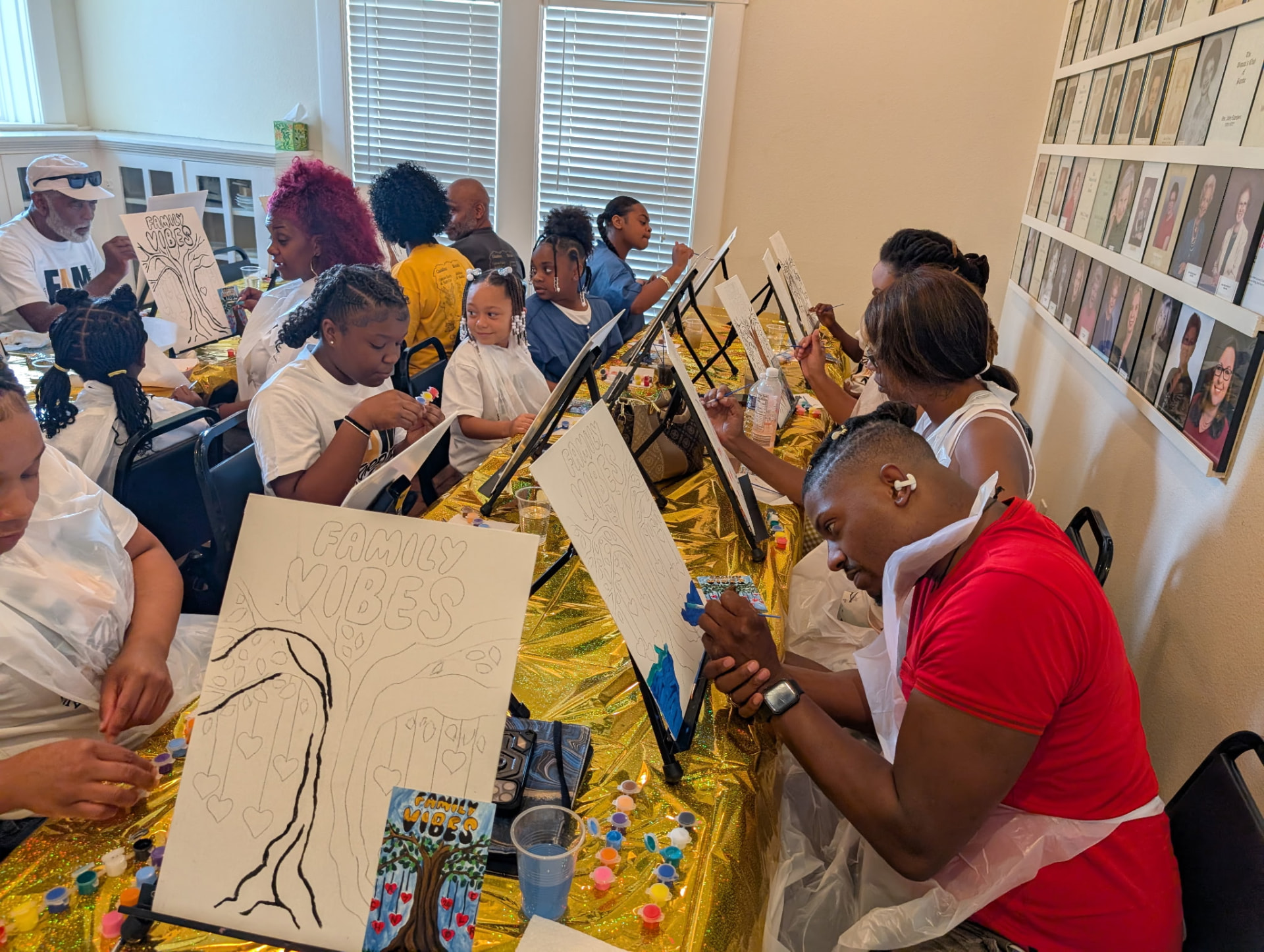 A full table of Chandler cousins sketching and painting their canvases