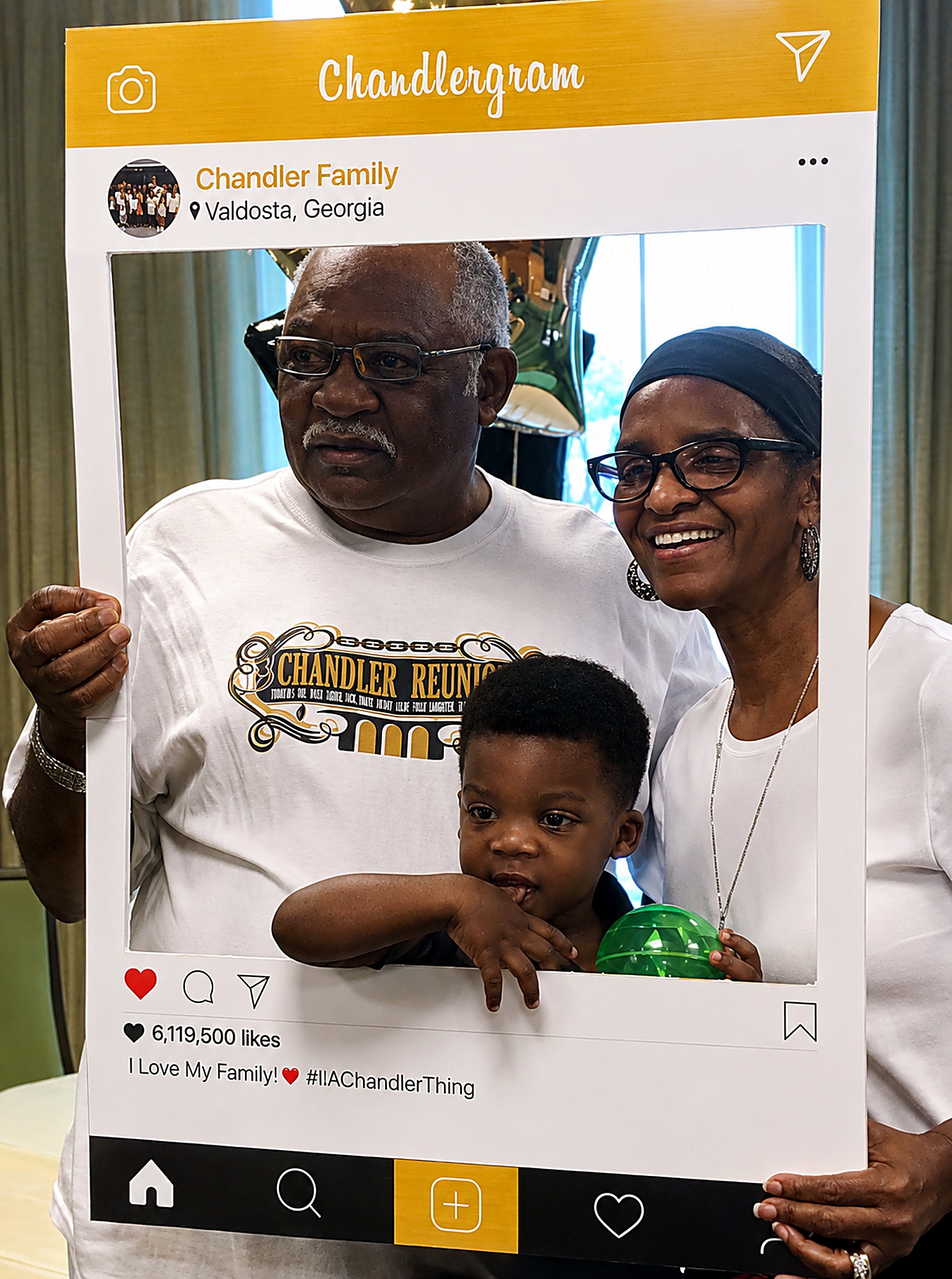 Grandparents and grandson posing inside the Chandlergram photo frame