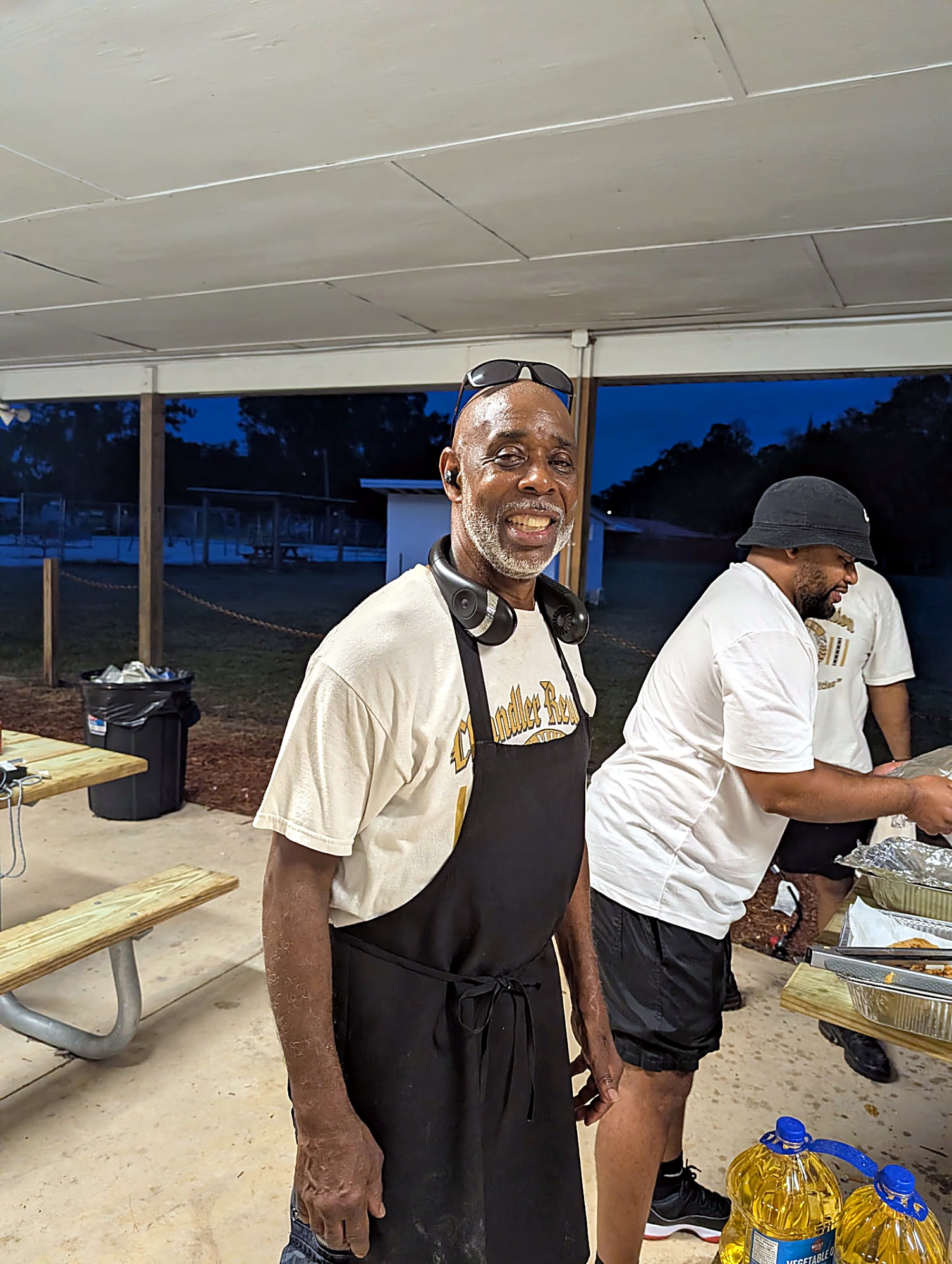 Family cooks serving up the evening fish fry at the reunion pavilion